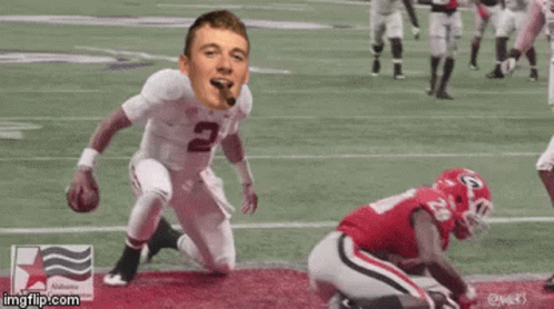 Football Player Number 2 Kneeling on Field