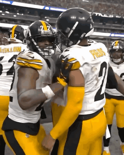 Football Player Number 2 Talking To Another Player GIF