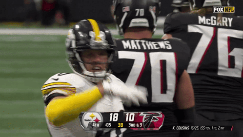 Football Player Number 20 Being Hugged