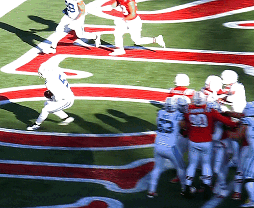 Football Player Number 20 Being Tackled GIF