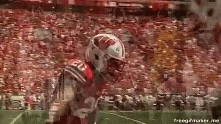 Football Player Number 20 Running on Field