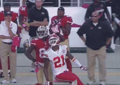 Football Player Number 21 Kneeling