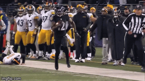 Football Player Number 21 Running Down Field