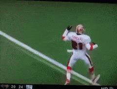 Football Player Number 21 Running on Field
