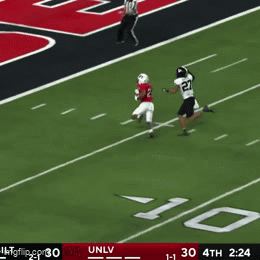Football Player Number 21 Running on Field
