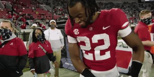 Football Player Number 22 Standing On Field GIF
