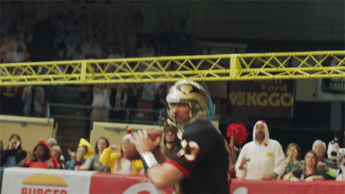 Football Player Number 23 Throwing Ball
