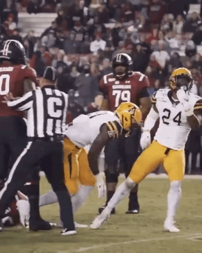 Football Player Number 24 Being Tackled