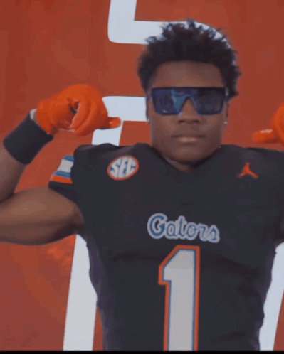 Football Player Number 24 Catching Pass