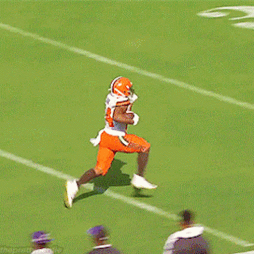 Football Player Number 24 Running on Field