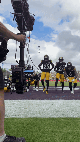 Football Player Number 25 Being Filmed