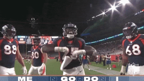 Football Player Number 25 Dancing With Teammates