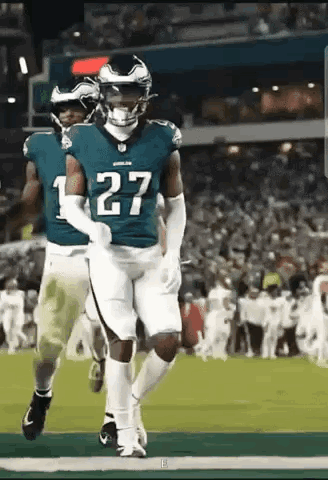 Football Player Number 27 Running