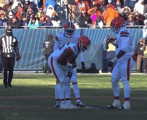 Football Player Number 28 Talking to Another Player