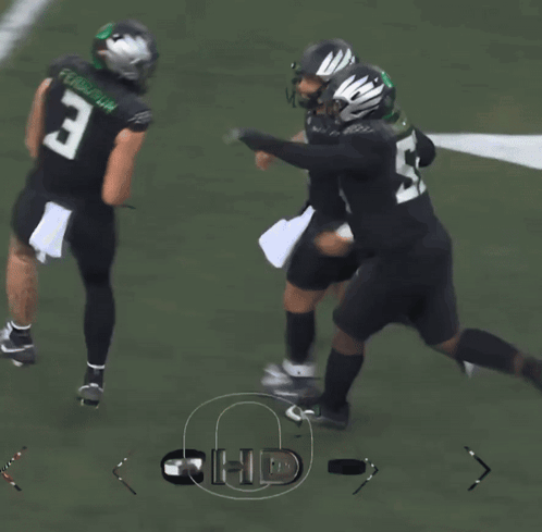 Football Player Number 3 Hugging Another Player
