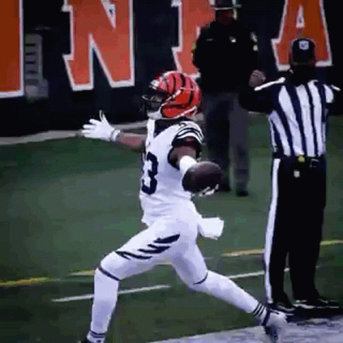 Football Player Number 3 Jumping With Referee GIF
