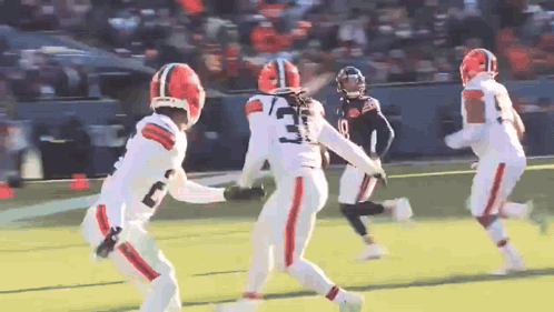 Football Player Number 3 Running on Field