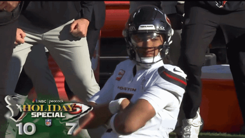 Football Player Number 3 Sitting on Field