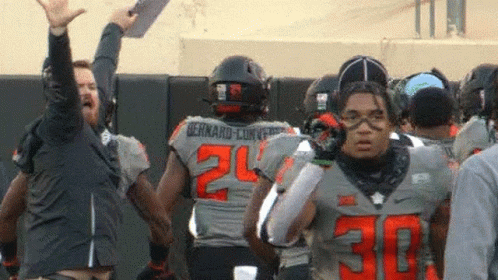 Football Player Number 30 in Front of Group