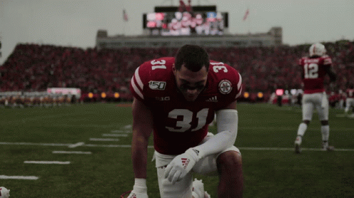 Football Player Number 31 Kneeling