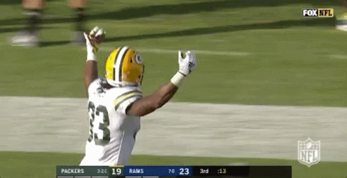Football Player Number 33 Celebrating Touchdown GIF
