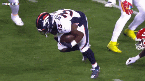 Football Player Number 33 Running With Ball