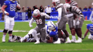 Football Player Number 38 Being Tackled