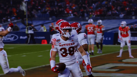 Football Player Number 38 Running With Ball