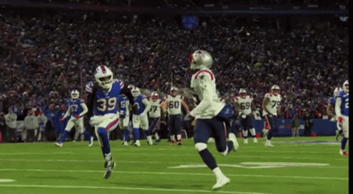 Football Player Number 39 Running on Field