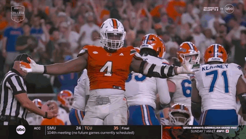 Football Player Number 4 Surrounded GIF