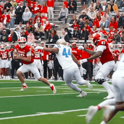 Football Player Number 44 Running With Ball