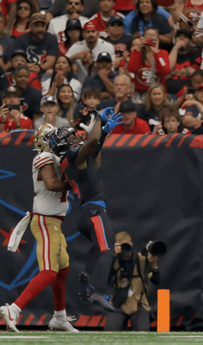 Football Player Number 5 Catching Ball