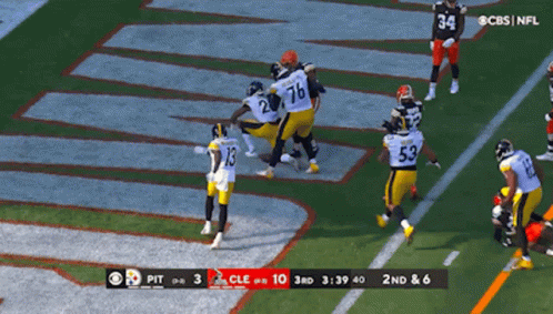 Football Player Number 5 Holding Football