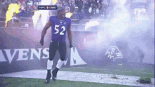 Football Player Number 52 Walking on Field