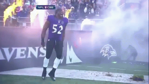 Football Player Number 52 Walking on Field