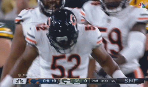 Football Player Number 52 With Teammates GIF