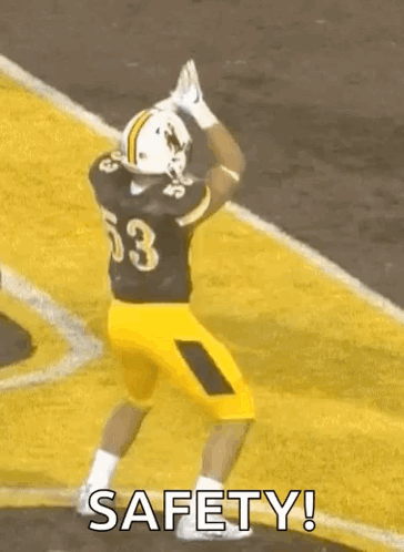 Football Player Number 53 Jumping Holding Football
