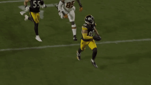 Football Player Number 56 Being Tackled