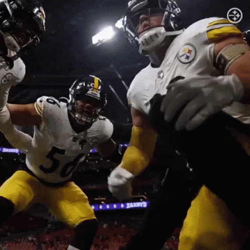 Football Player Number 56 Being Tackled