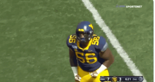 Football Player Number 56 Running