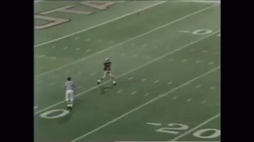 Football Player Number 6 Being Tackled