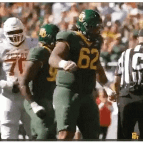 Football Player Number 62 Next To Another Player GIF