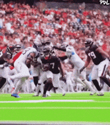 Football Player Number 7 Being Tackled