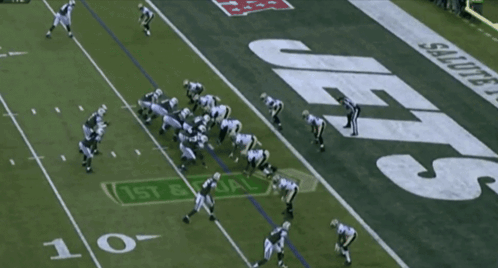 Football Player Number 7 Being Tackled