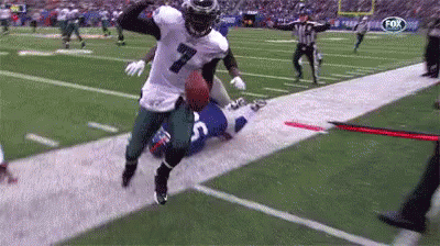 Football Player Number 7 Running With Ball