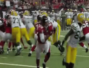 Football Player Number 7 Surrounded by Players