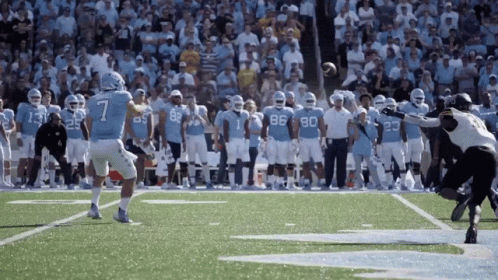 Football Player Number 7 Throwing Ball