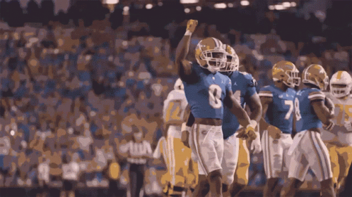 Football Player Number 8 Jersey Fist in Air
