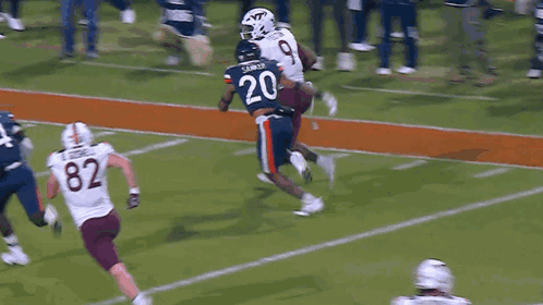 Football Player Number 82 Being Tackled