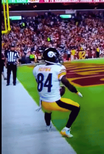 Football Player Number 84 Kneeling on Field
